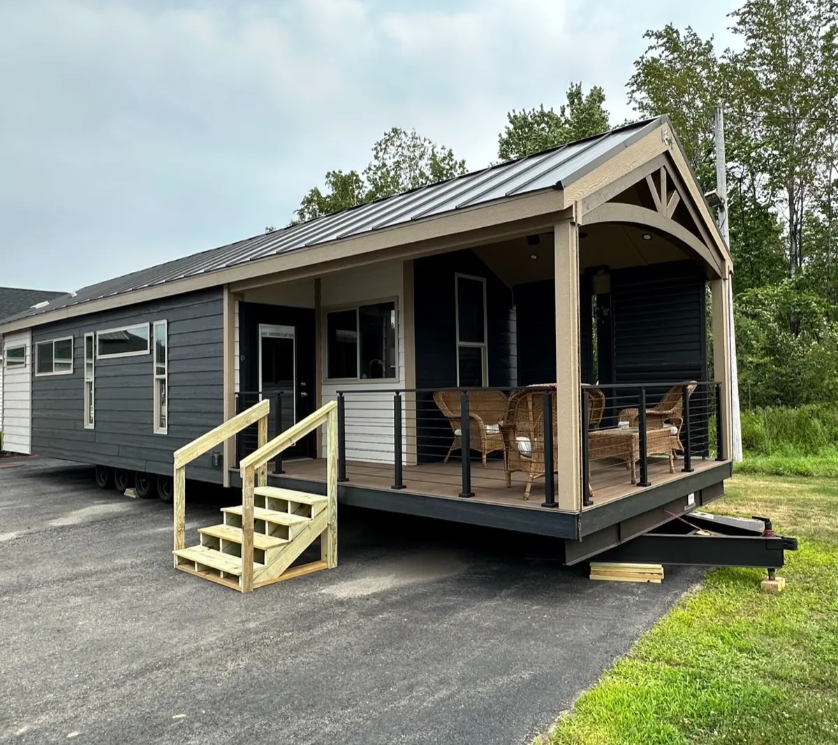Kropf Eldorado park model with a covered front porch, sited at Outpost Outfitters