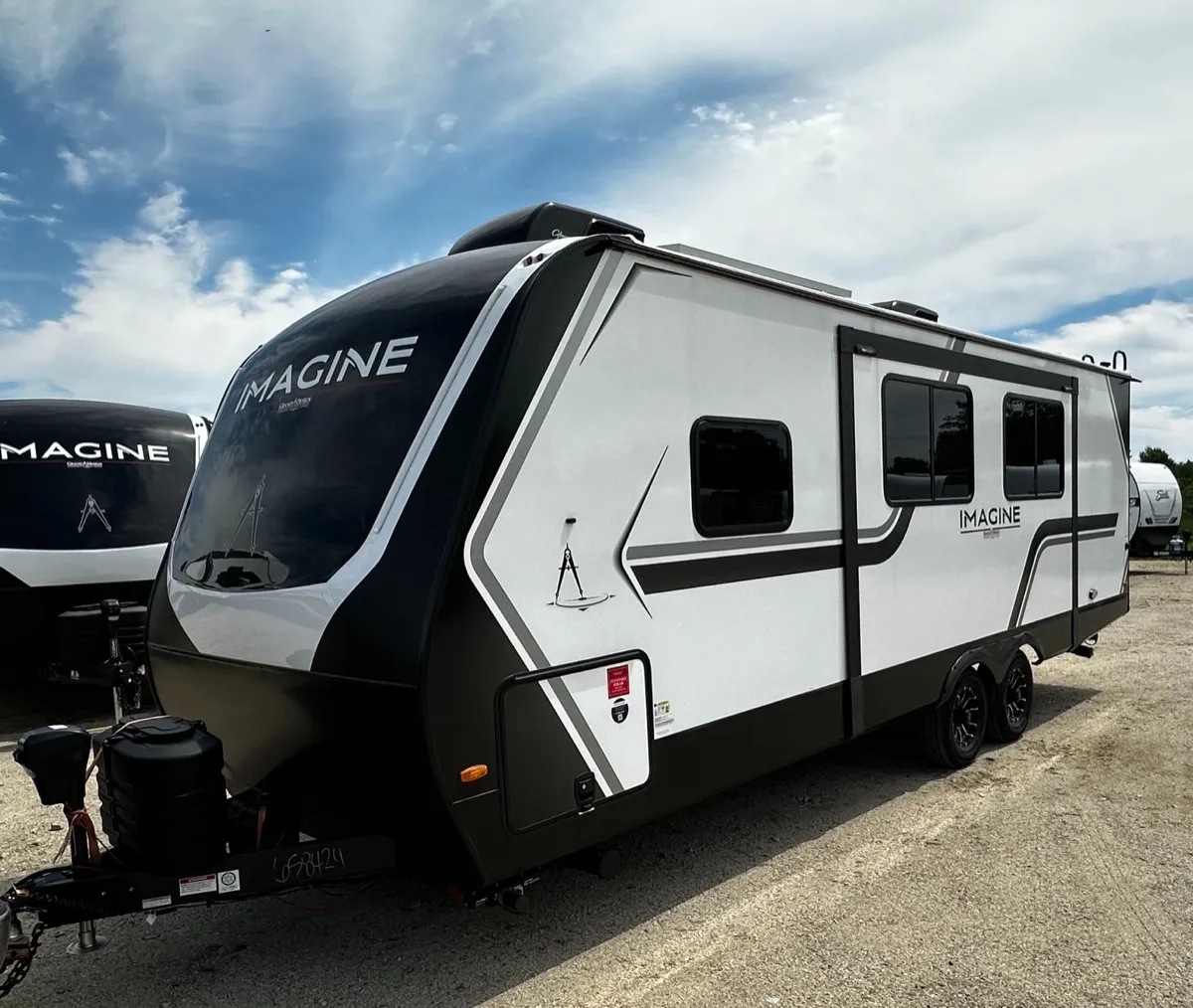 Grand Design Imagine travel trailer parked on the Outpost Outfitters lot